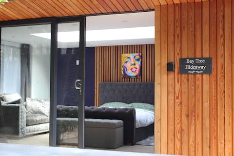Popular Airbnb listing: Bay Tree Hideaway |Guest House Bath | Free Parking in Englishcombe