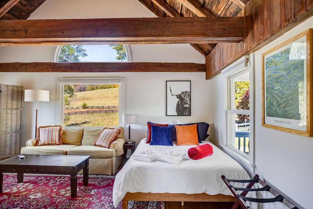 In the Cottage (available to rent for an additional fee): This queen bed is in a peaceful space with a full private bathroom and kitchenette. 