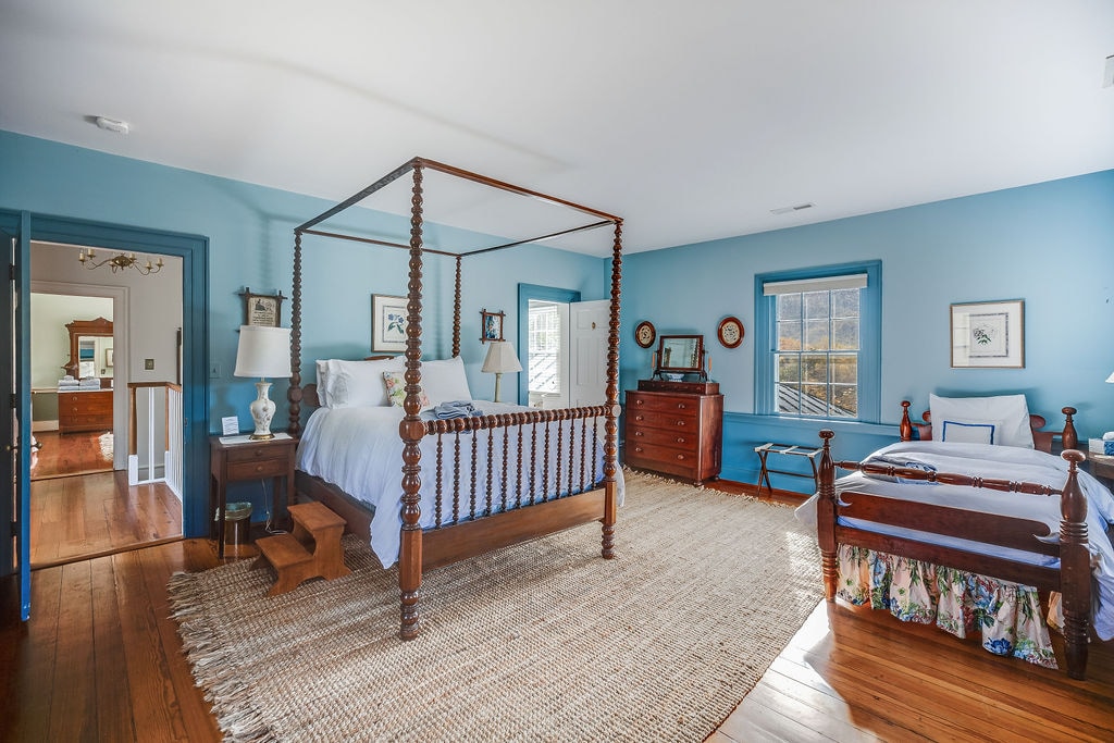 In the Farmhouse: The Blue Bedroom includes a full bed and twin bed, and an en suite bathroom. 