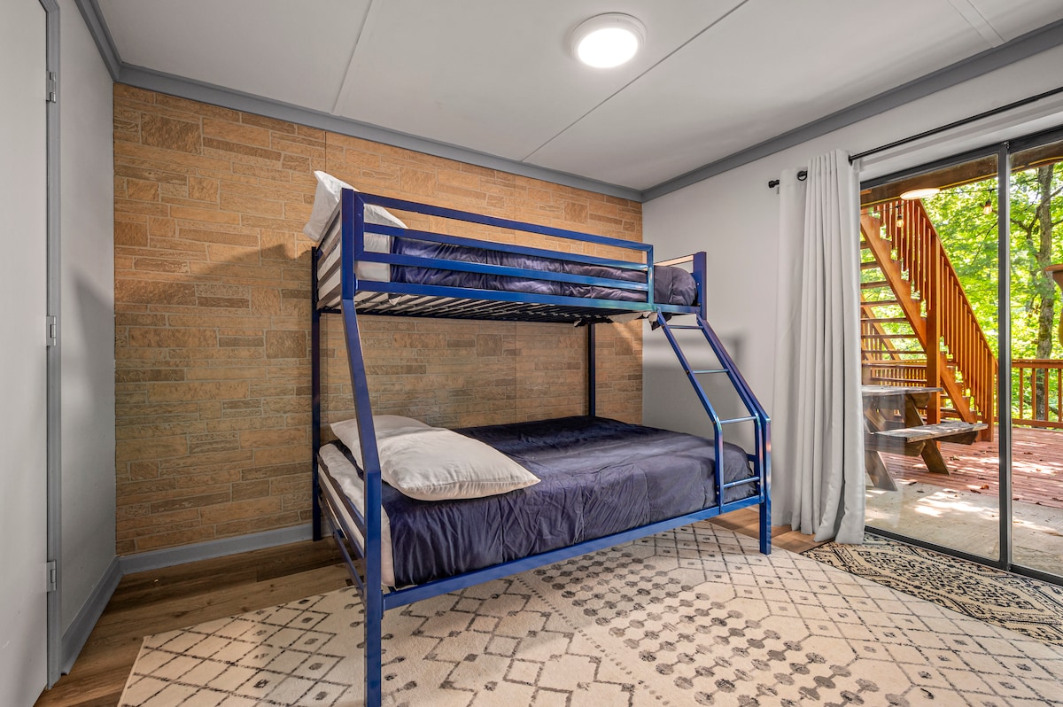 Bunk bed with a full on the bottom bunk and twin on top. Has sliding door to large deck. This room is downstairs, where the game area and 2nd living area is located. 