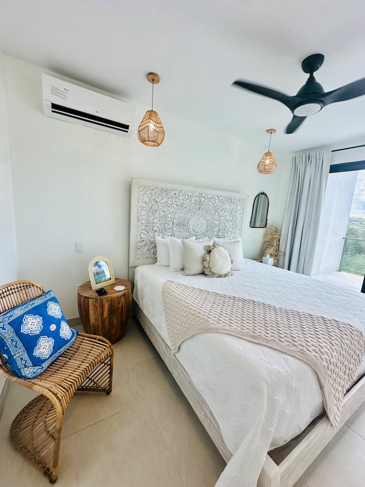The Bougainvillea suite. Top floor as you enter the front door first bedroom king bed with en suite bath and walk-in closet.
