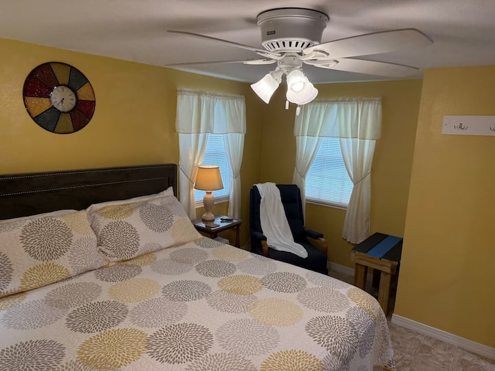 Our Sheriff & Police themed King Bedroom; offers a comfy King bed, Roku TV, levoit air purifier, fan, luggage rack, closet, mirror, two night stands with two lamps and one extra charging outlet, recliner and blanket.