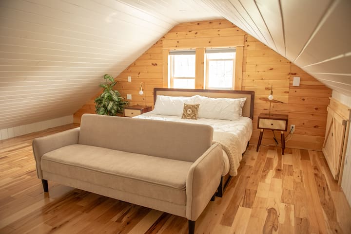 King sized bed and a fold down sofa bed