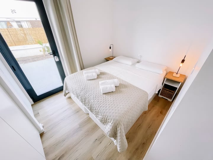 Bedroom downstairs with Queen Size bed or 2 Single Beds with entrance to the pool.