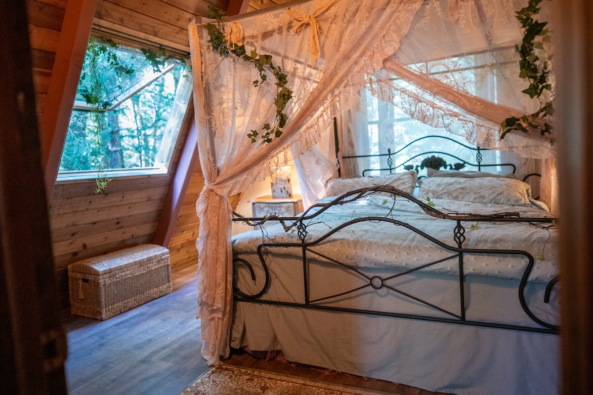 Drift to sleep beneath twinkling lights and wake to a forest symphony. Your canopy bed feels like a secret woodland nest wrapped in comfort.