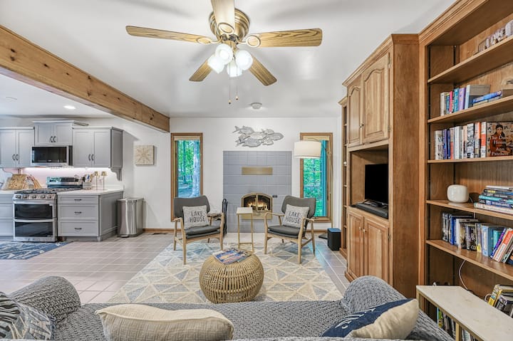 Warmth and charm radiate from the heart of the home, complete with cozy seating and a glowing fireplace.