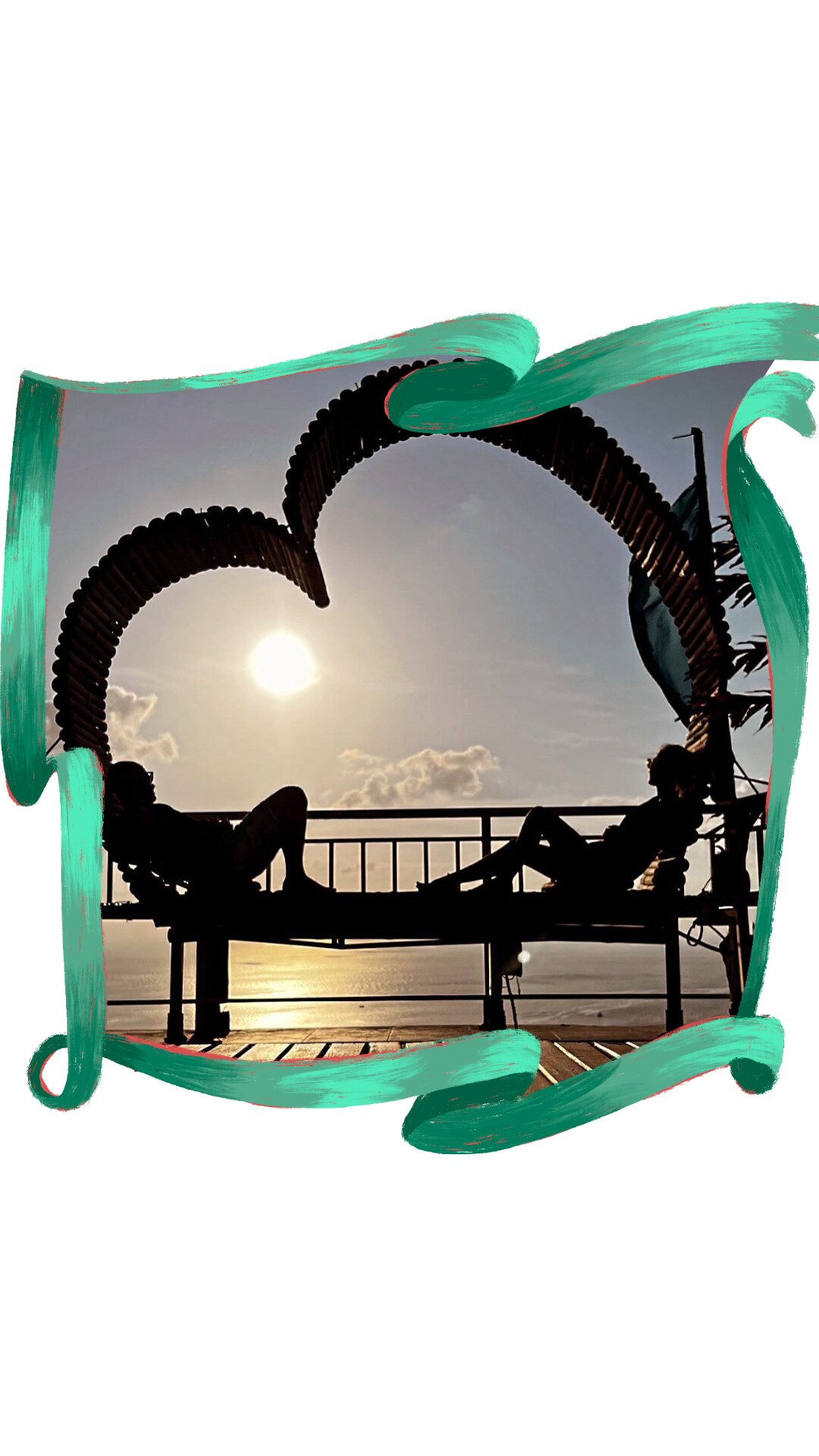 Two individuals are seen lounging on a deck, silhouetted against a setting sun. The scene features an artistic heart-shaped structure, highlighting a peaceful moment. The ocean can be faintly seen in the background, emphasizing a serene atmosphere during twilight.