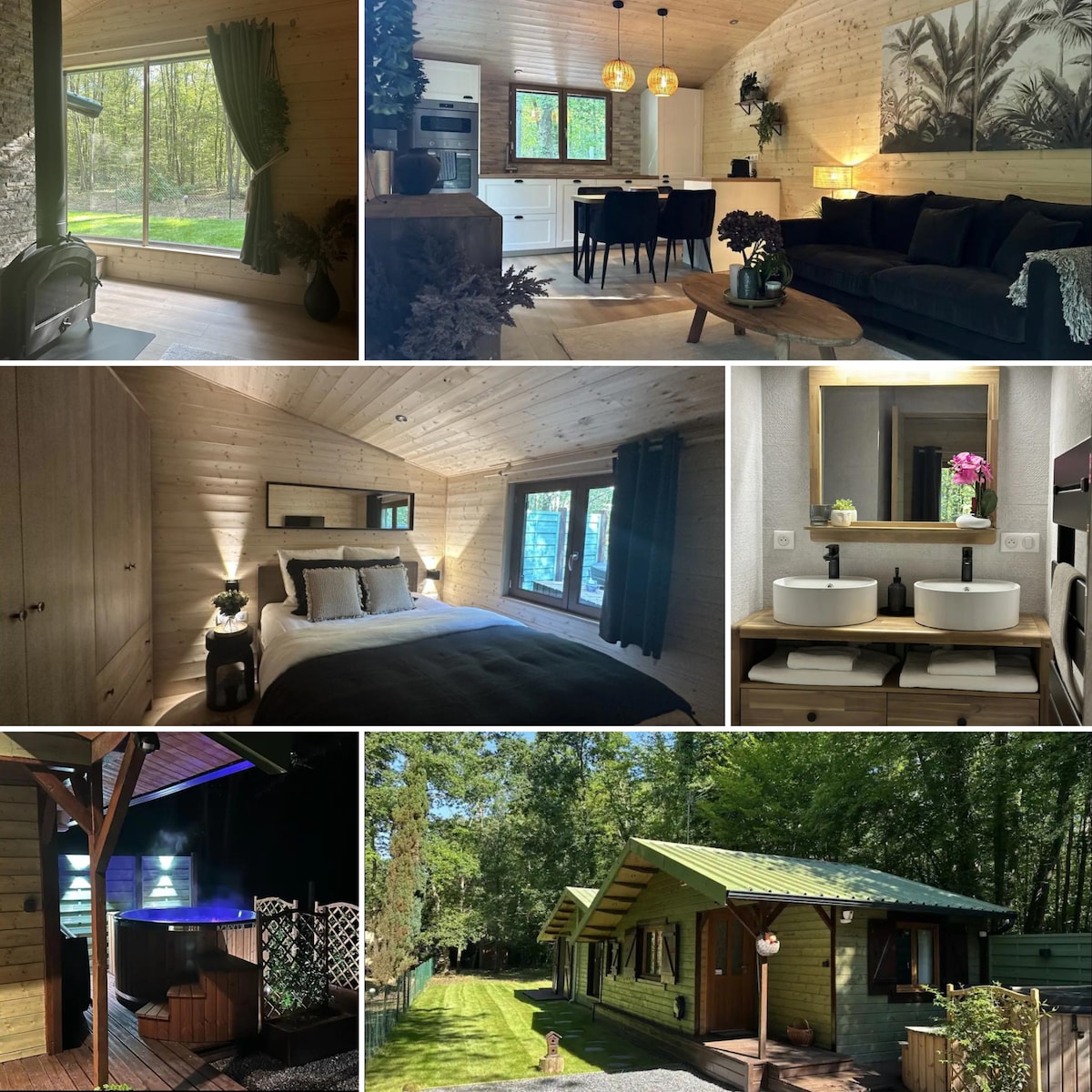 A spacious living area features large windows that view the surrounding forest, with a comfortable sofa and a dining table for four. The kitchen area includes modern appliances and cabinetry, while the overall decor is warm and natural, highlighted by wooden accents.
