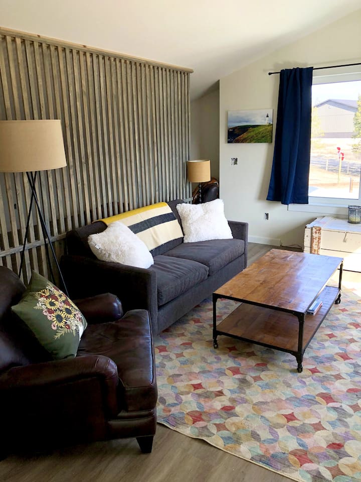 Although the suite is technically a 'studio', the living area is partially separated from the sleeping area by a wooden privacy wall. You'll have a comfy couch and additional seating. And you're sure to enjoy the incredible views!