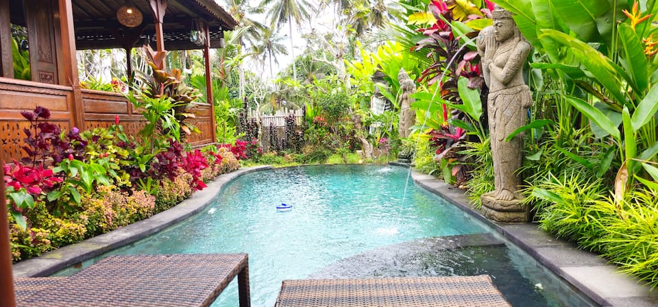 A carved wooden Joglo house in the Ubud rice fields, Ubud, Bali, Indonesia, photo 9 of 10