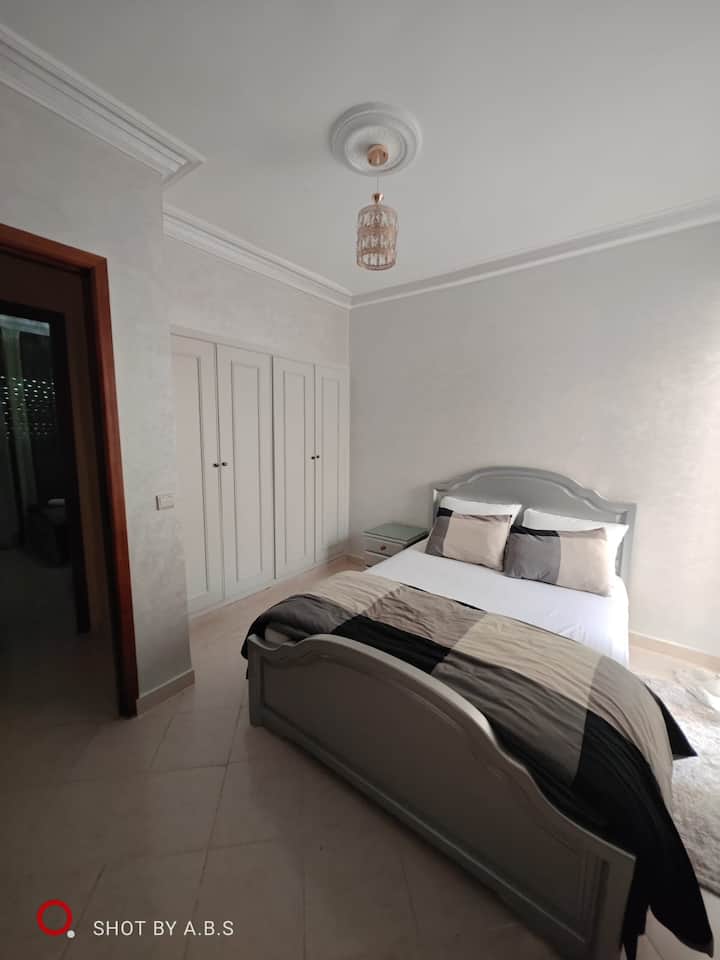 big bed, patio, wardrobe, mirror, cover, pillows,  towels, bedside table, carpet...