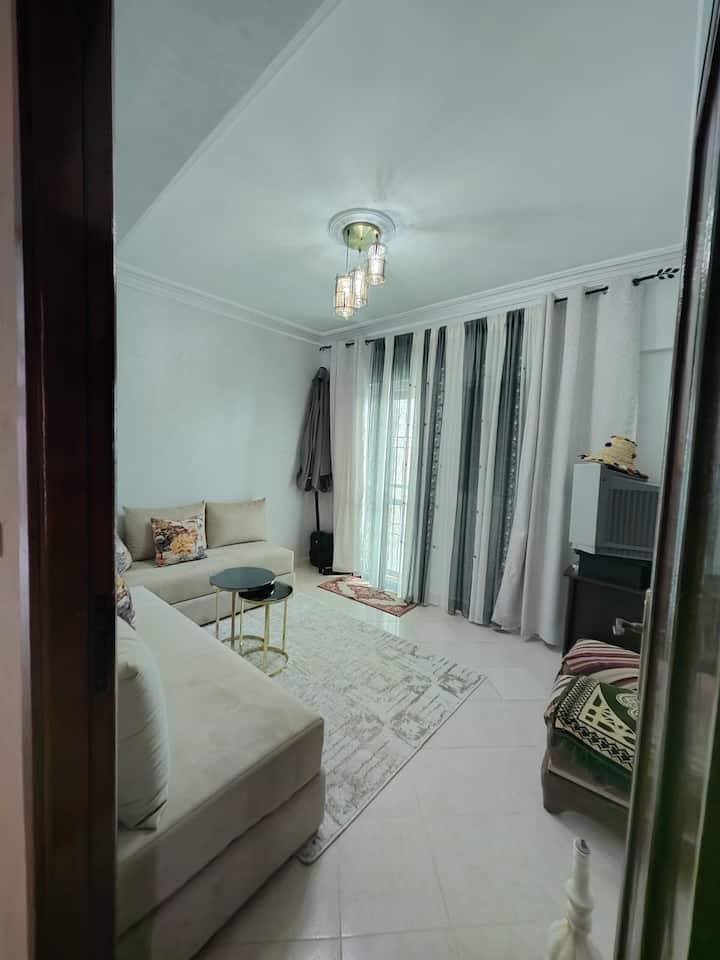 2 sofas, glass table and access to the terrace