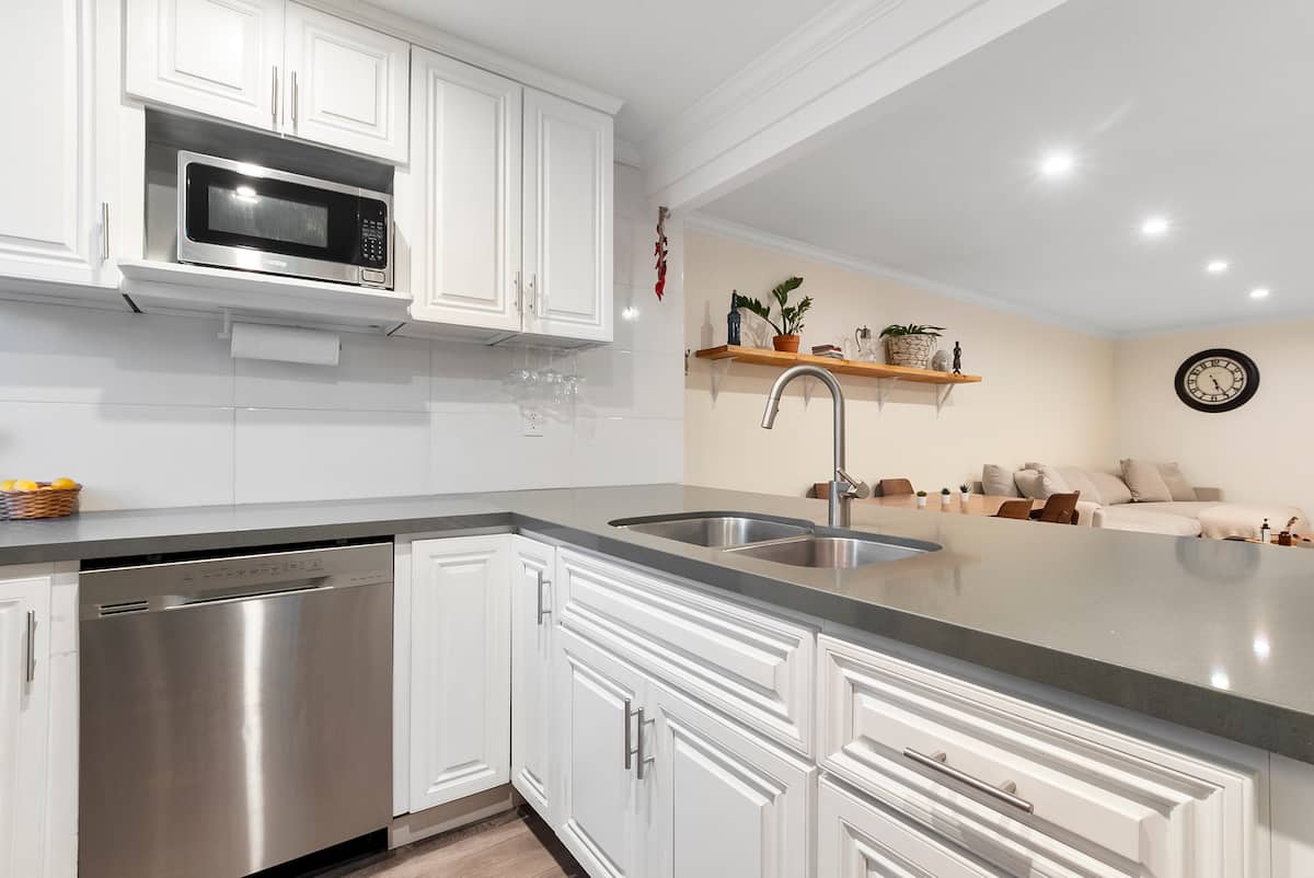 Private balcony with seating overlooking landscaped San Diego community grounds