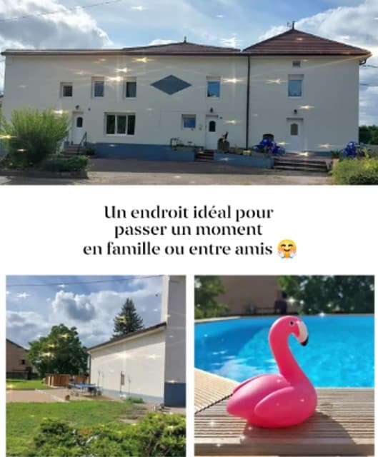 A spacious outdoor area features a clear swimming pool with a pink flamingo float. The two-story building is seen in the background, with a well-maintained lawn and seating arrangements surrounding the pool, inviting relaxation and enjoyment for families and friends.
