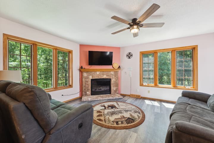 Fireplace room: features couch and loveseat, each with 2 recliners, fireplace, Roku TV