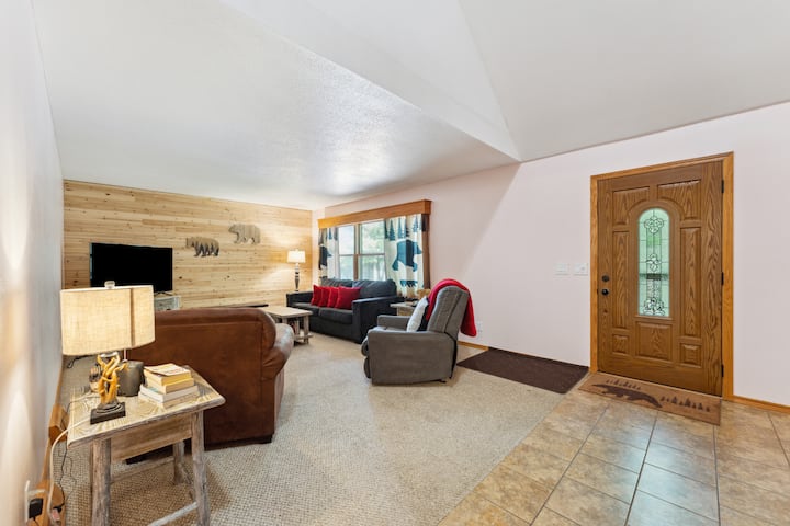 Living room with sleeper couch, recliner, chair, Roku tv, and blu-ray player with lots of movies. Relax with the family and watch a movie. 