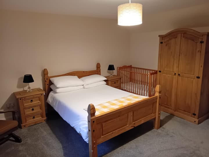 Double Bedroom with cot - rear garden views