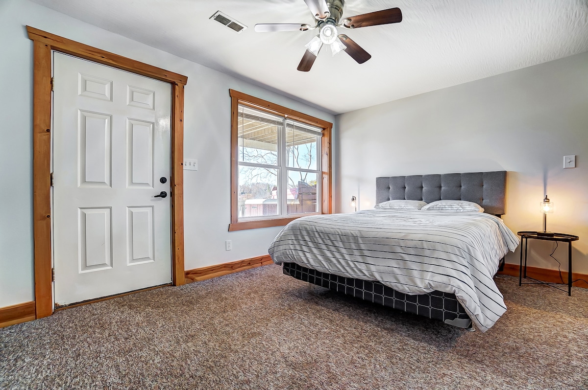 Walkout basement bedroom 3 featuring a queen bed and closet.