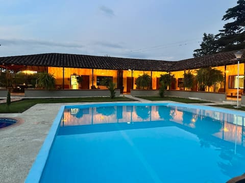 A fully-equipped vacation home with a swimming pool and river