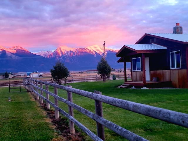 Cabin with late summer alpine glow on Mission Mtns.