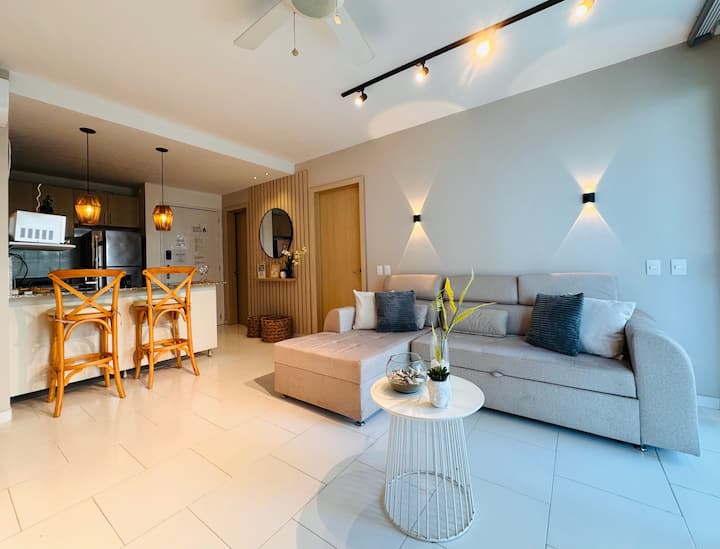 Bright and inviting living room with cozy seating and soft lighting.