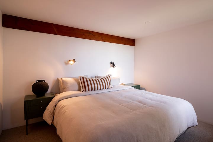Bedroom three- a cozy king-sized bed secluded away