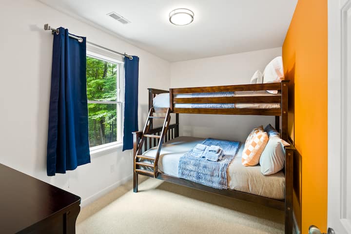 Our upstairs twin-over-full bunk bed. Plus, room darkening shades for the big kids!!