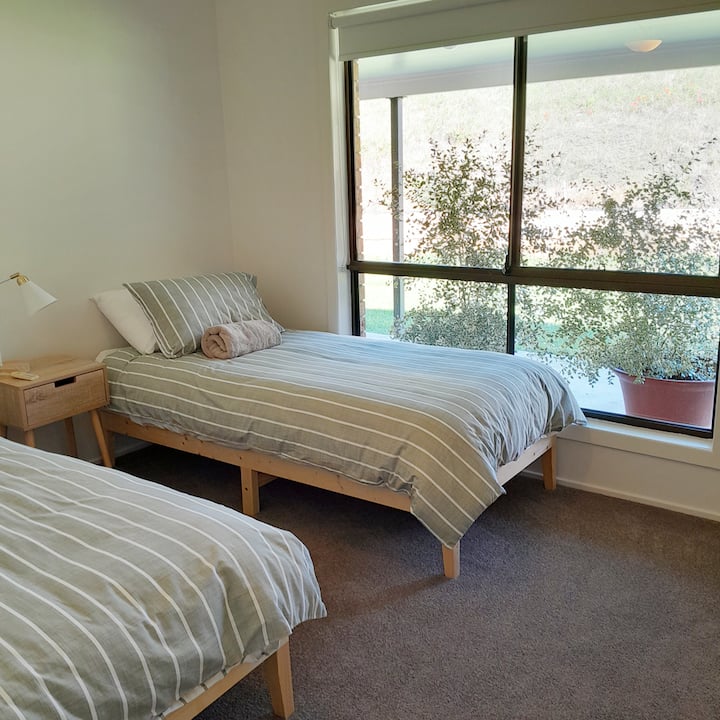 2 single beds, with block out blinds and ceiling fan
