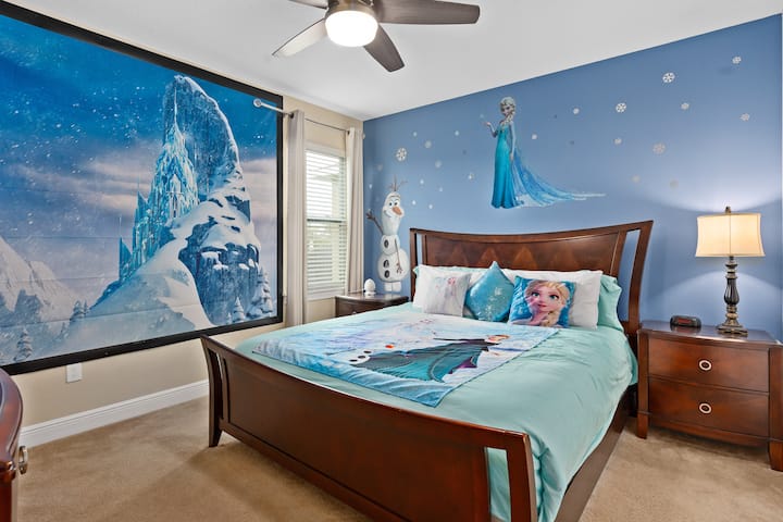 Step into this Frozen themed room which features Olaf and Elsa Murals, snowflake accents, and shimmering frosty details that evoke the magic of Arendelle.  All centered around a beautiful King bed