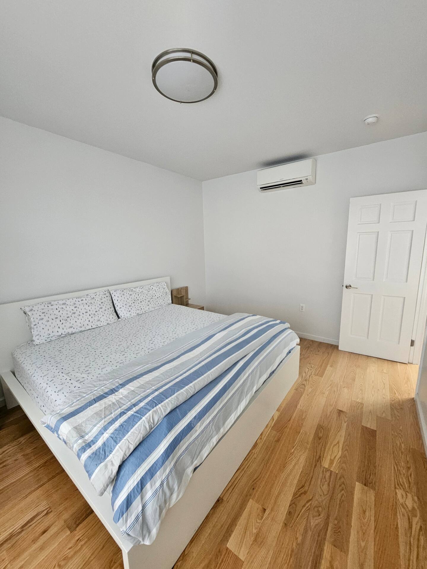 Private bedroom with a king bed and air conditioning