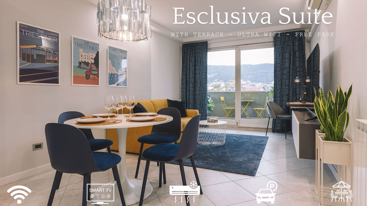 The living area features a round dining table set with four chairs, complemented by a cozy sofa and a large window providing natural light. Decorative artwork is mounted on the walls, enhancing the modern aesthetic of the space.