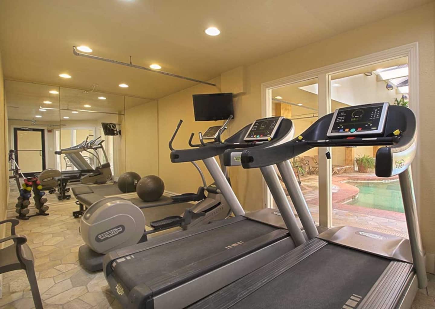 On-site fitness room with cardio and weights, perfect for a quick workout before hitting the beach.