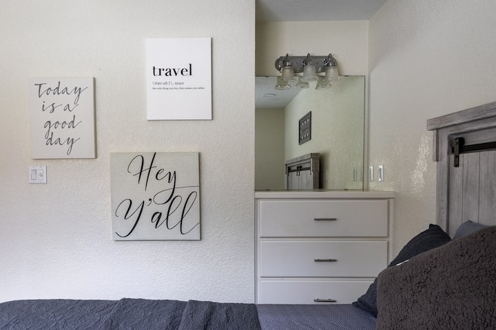Stylish vanity with storage and bright lighting—great for getting ready before heading out on water adventures.