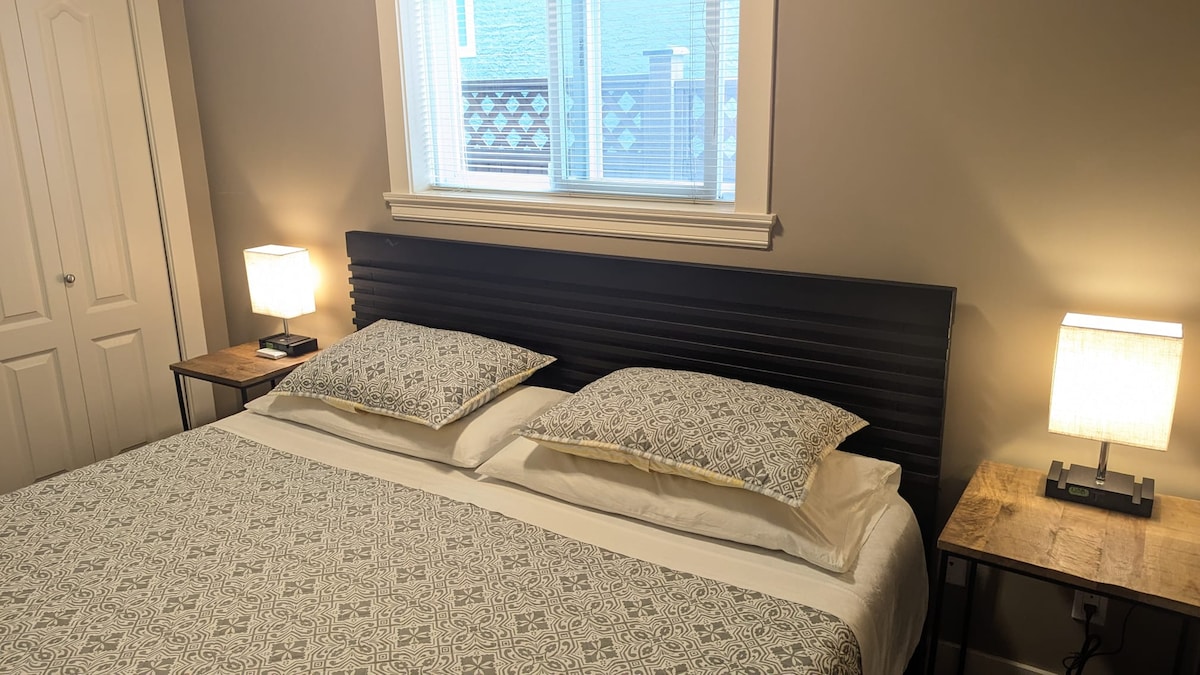 Bedroom with huge king-size bed and closet with safety box