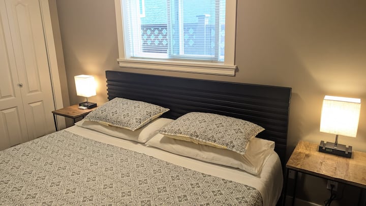 Bedroom with huge king-size bed and closet with safety box