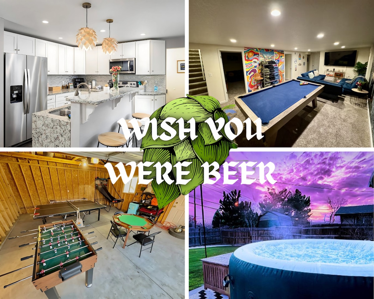 The modern kitchen features sleek white cabinetry, stainless steel appliances, and a granite island, providing ample space for meal preparation. An entertainment area showcases a pool table and colorful wall art, while an inviting backyard highlights a hot tub under a picturesque sunset.