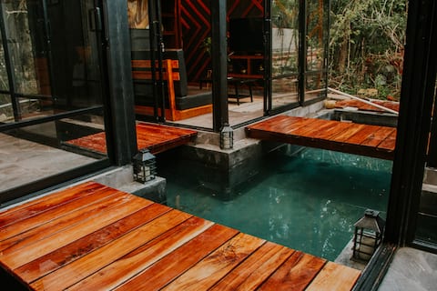 Cross house surrounded by water K NAJ with cenote