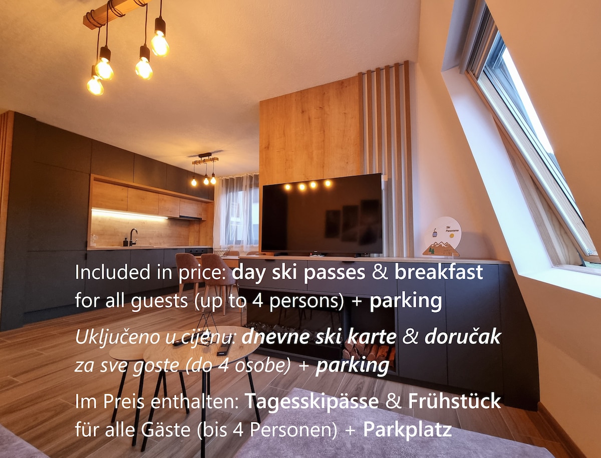 A modern living area features a wall-mounted flat-screen TV and warm wooden accents. Natural light floods through windows adorned with blackout blinds, enhancing the cozy atmosphere. Essential amenities such as ski passes and breakfast are highlighted, ensuring a complete stay for up to four guests.