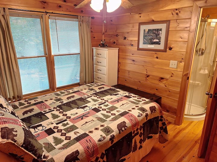 Guest bedroom with recently added private shower and sink! There is a half bath with a toilet and sink just outside of the guest bedroom in the hallway.