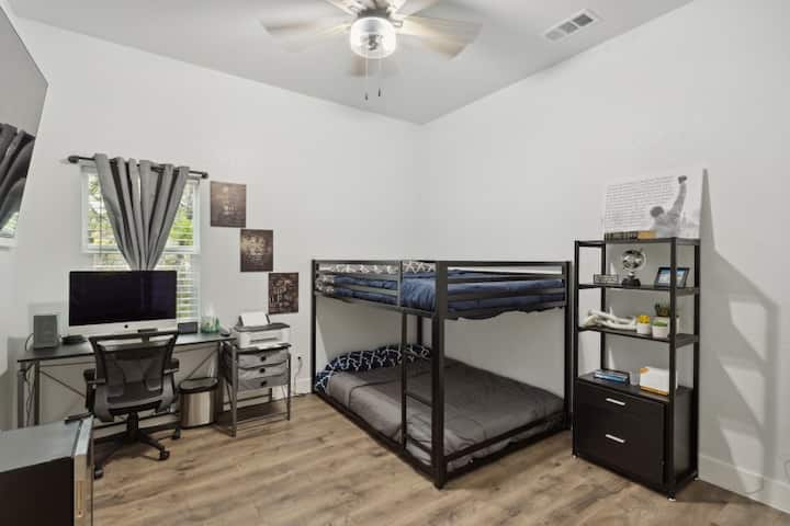Bedroom #3 with two full sized bunk beds. There is also a full size desk in the room to provide a computer workspace. Router is located on desk with ethernet cable to directly connect to the network if desired.