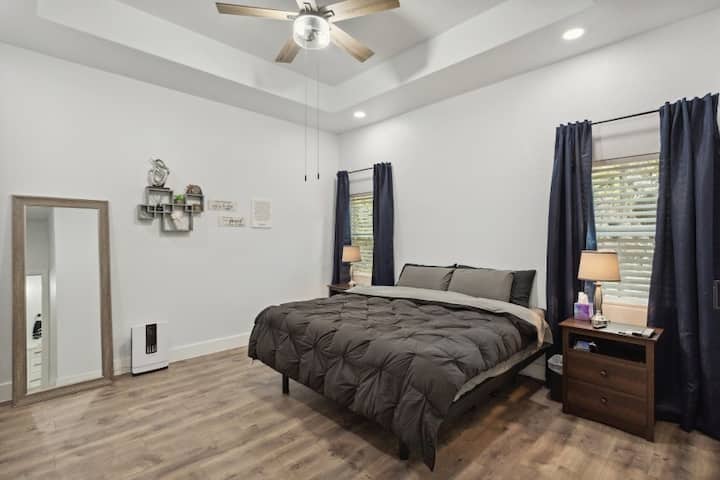 Master Bedroom

1 King Bed with electric fire place (which has an actual heating element), premium TempurPedic mattress, and an adjustable bed frame.