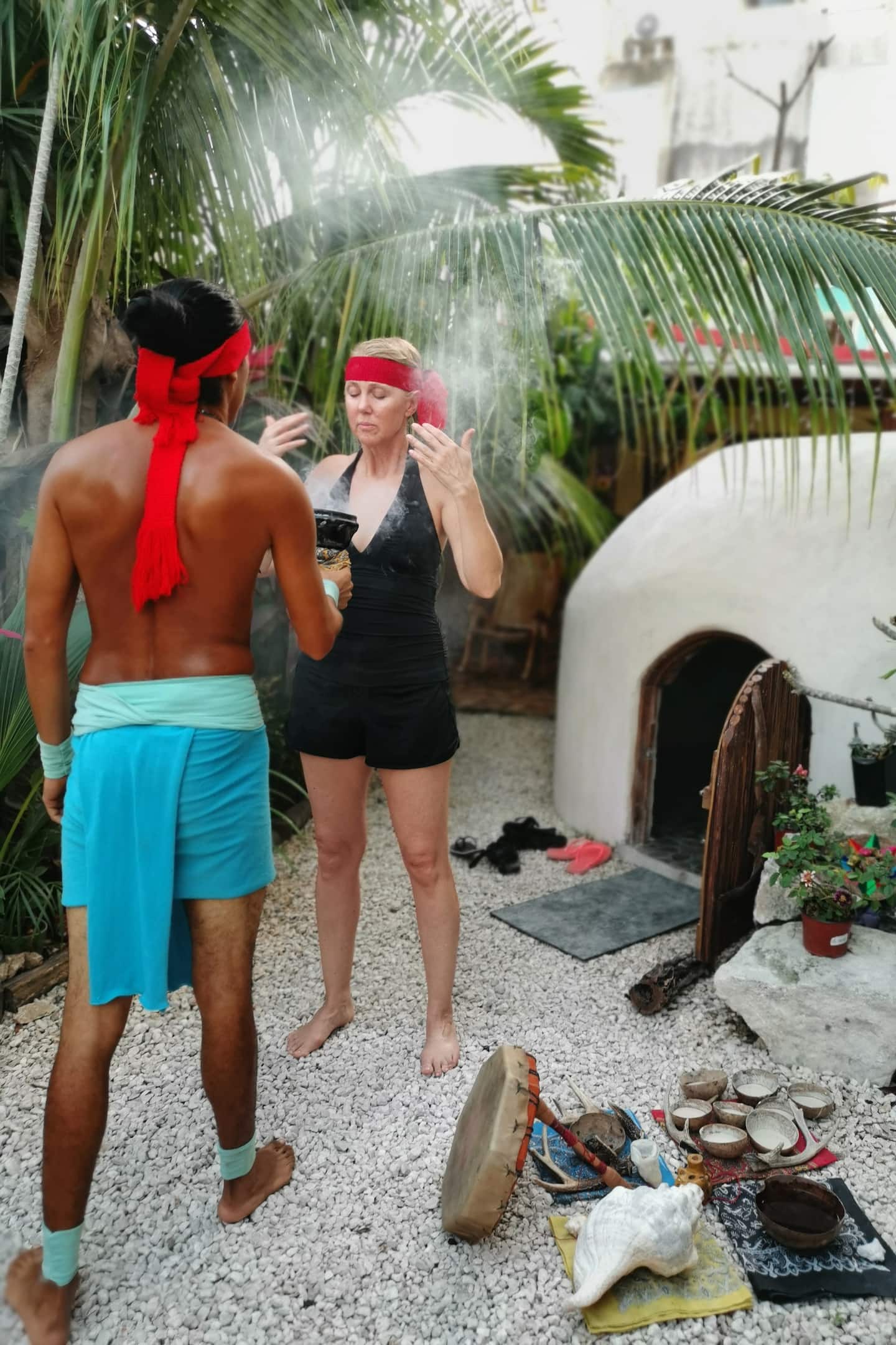 woman participating in temazcal ceremony