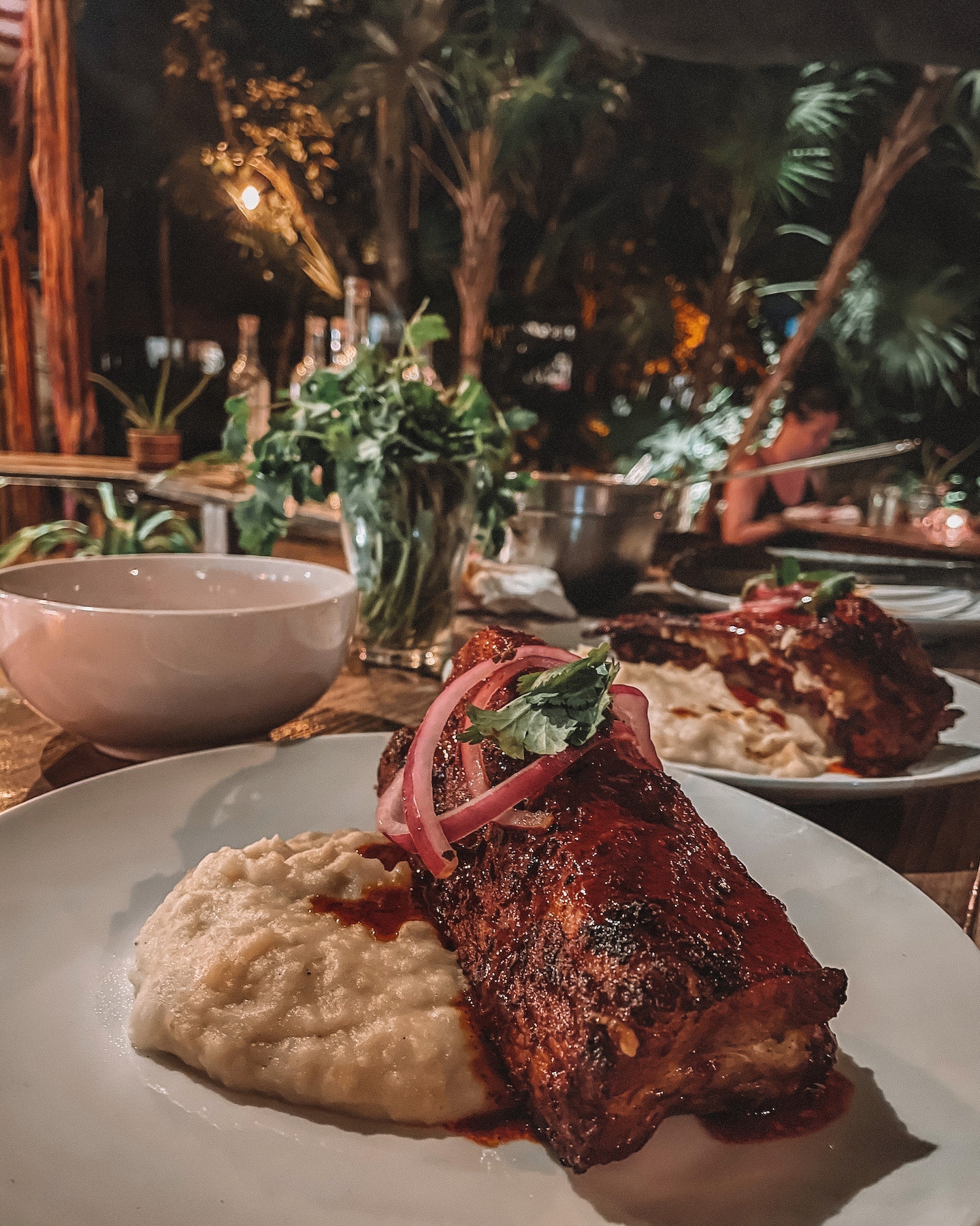 steak on a plate at the dinner table during a Tulum food tour