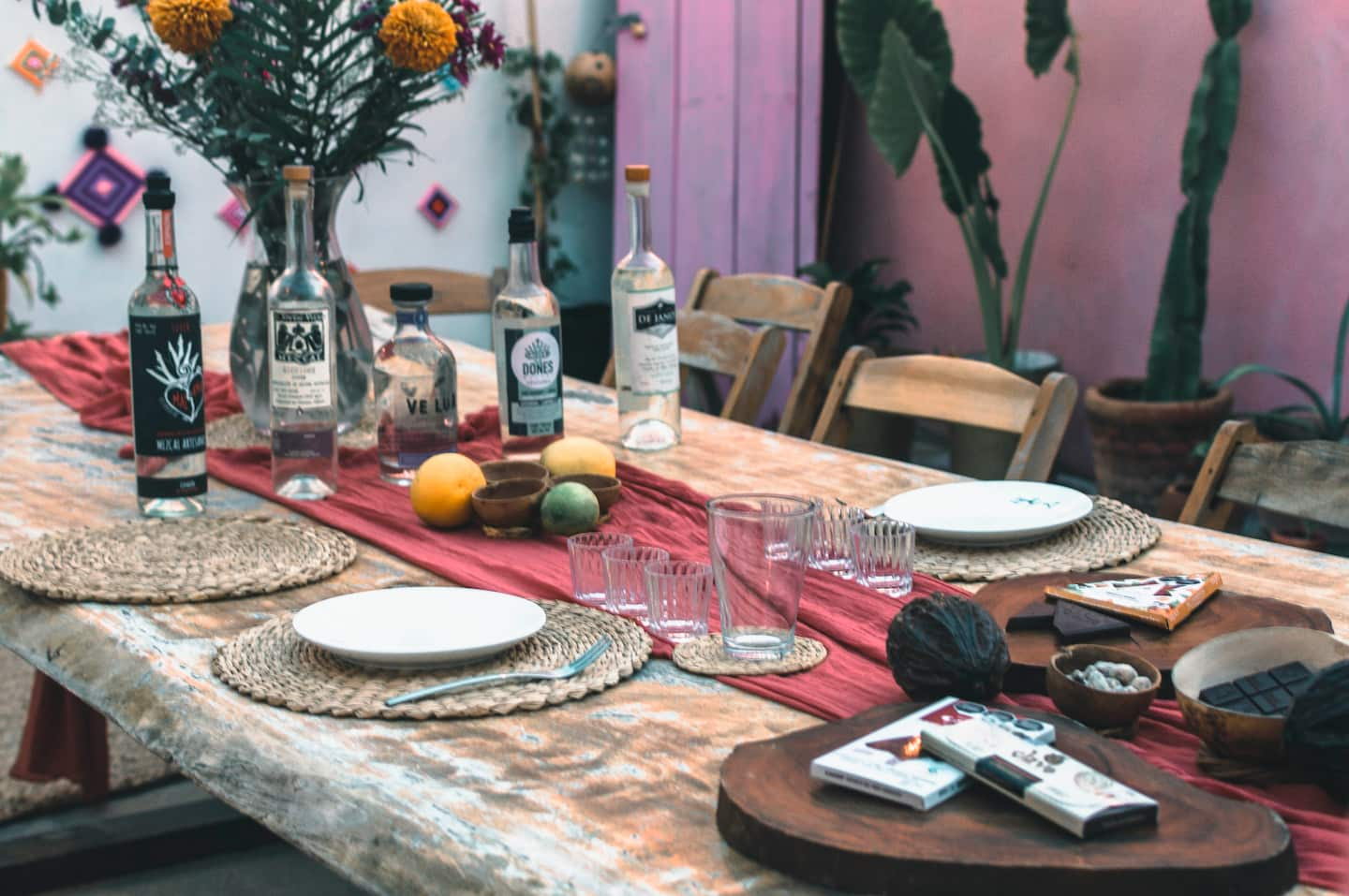 shots of mezcal with slices of oranges