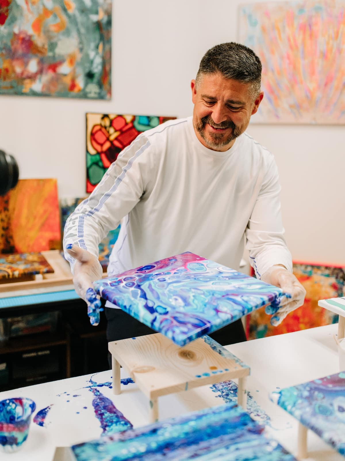 Man making acrylic art