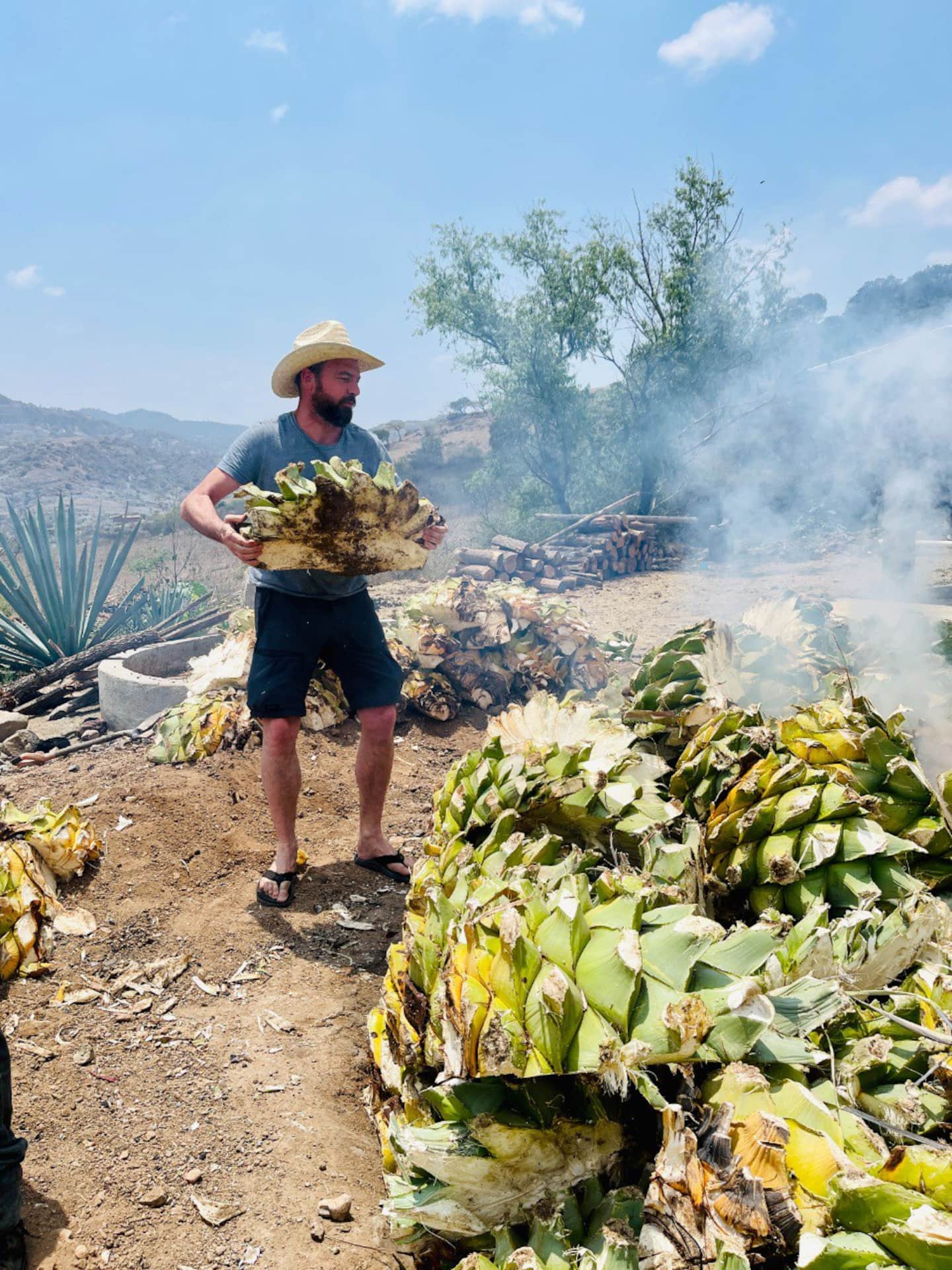 bartender pouring mezcal into a small cup