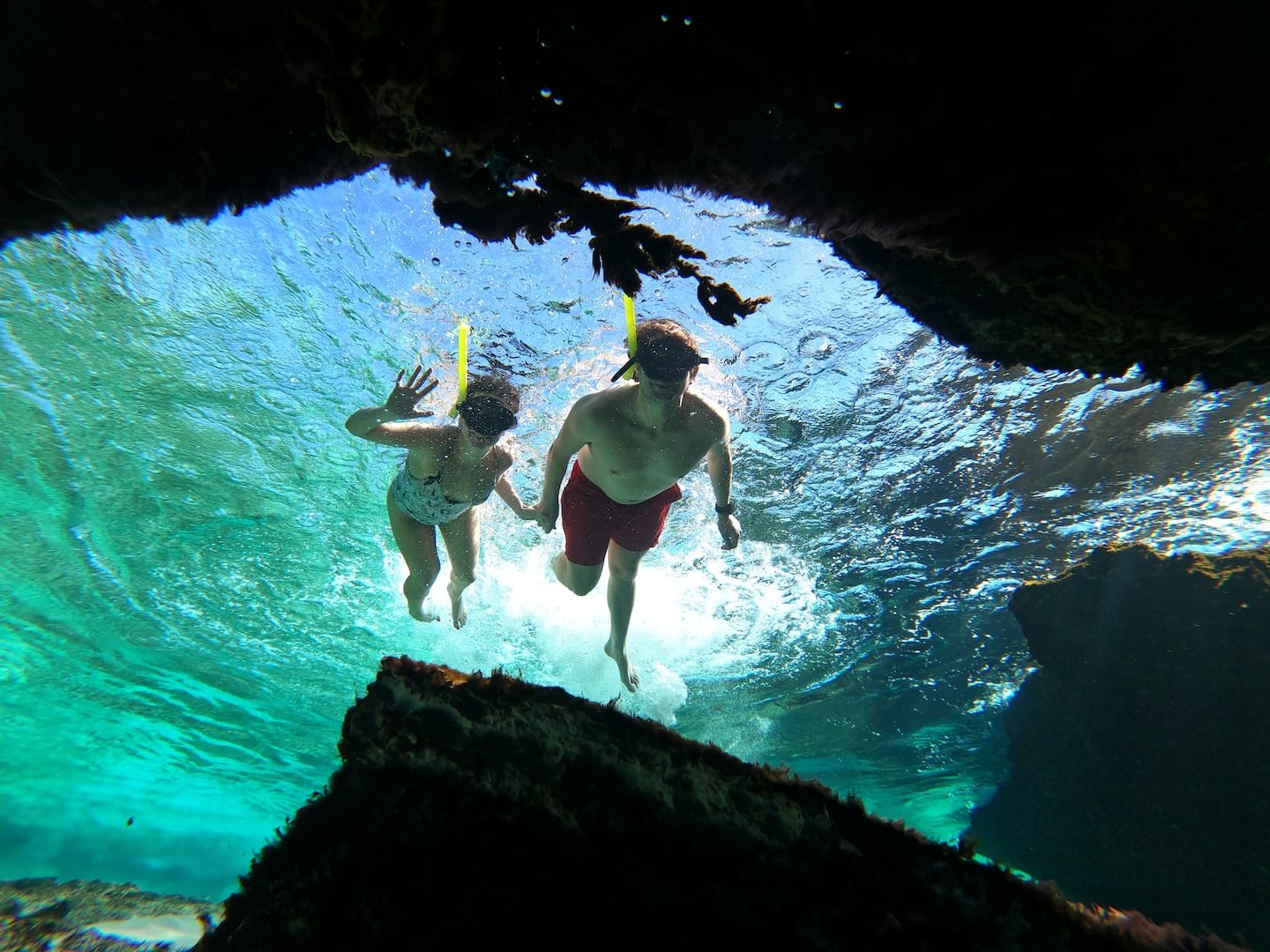 two people doing snorkeling in tulum mexico