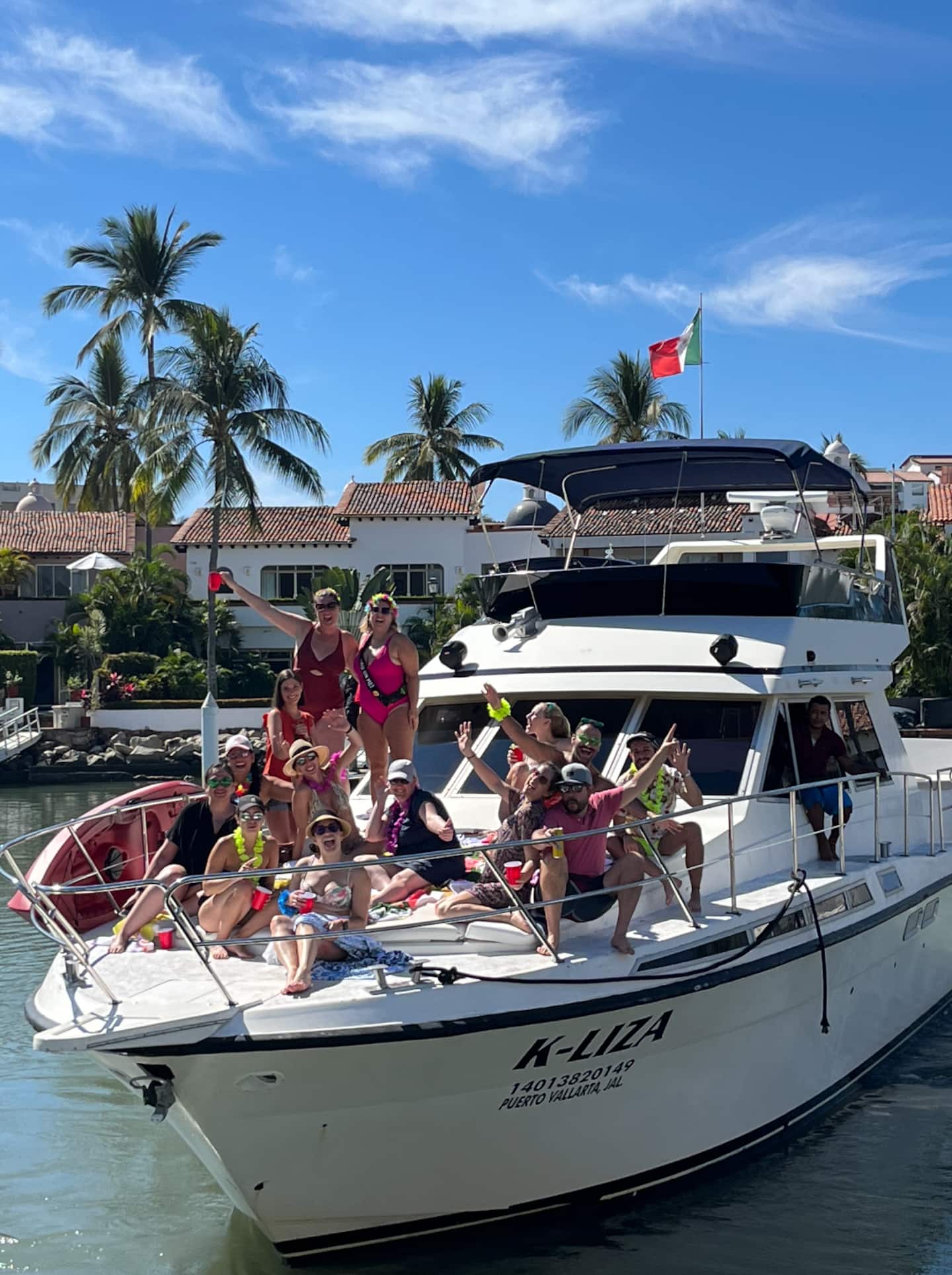 group of tourists in a yacht posing for a picture | Puerto Vallarta private boat tours
