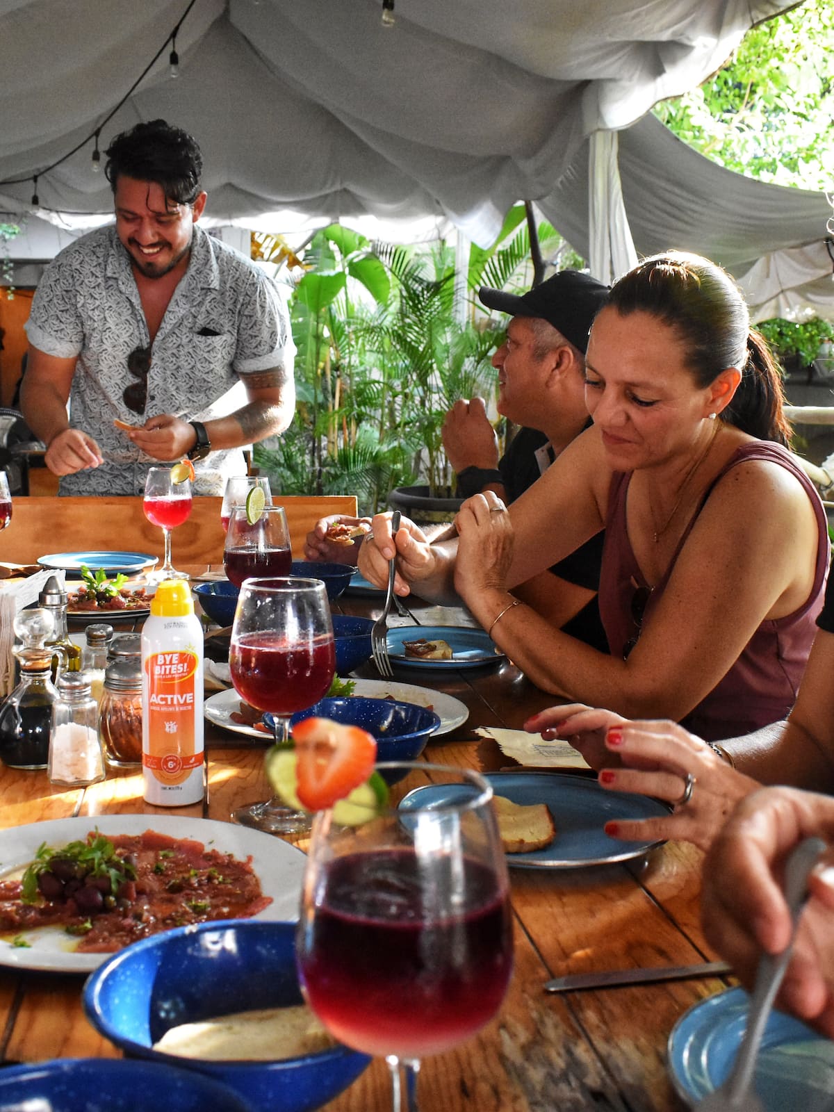 group of friends enjoying Mexican food and drinks