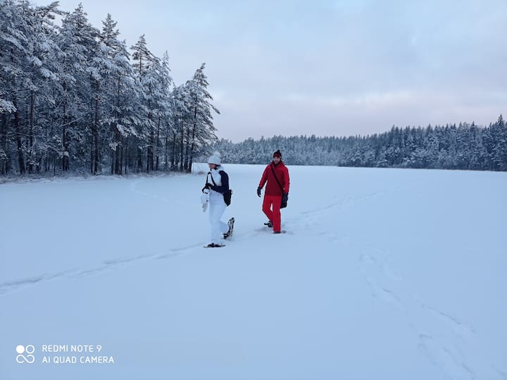 Hiking with snow shoes on a lake